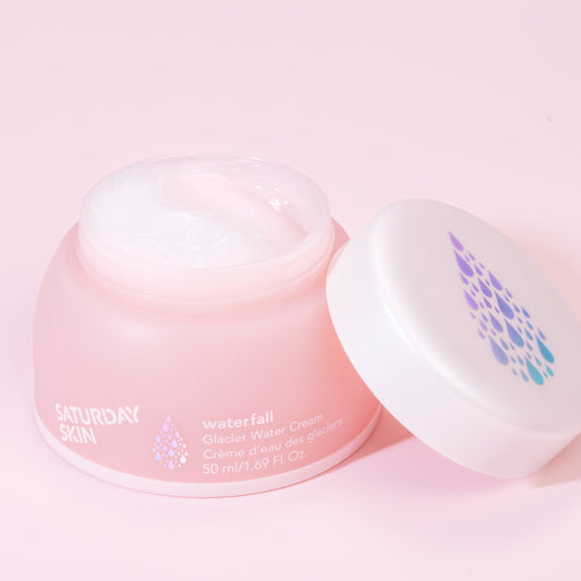 Pink skincare product with Saturday Skin branding on a pink background