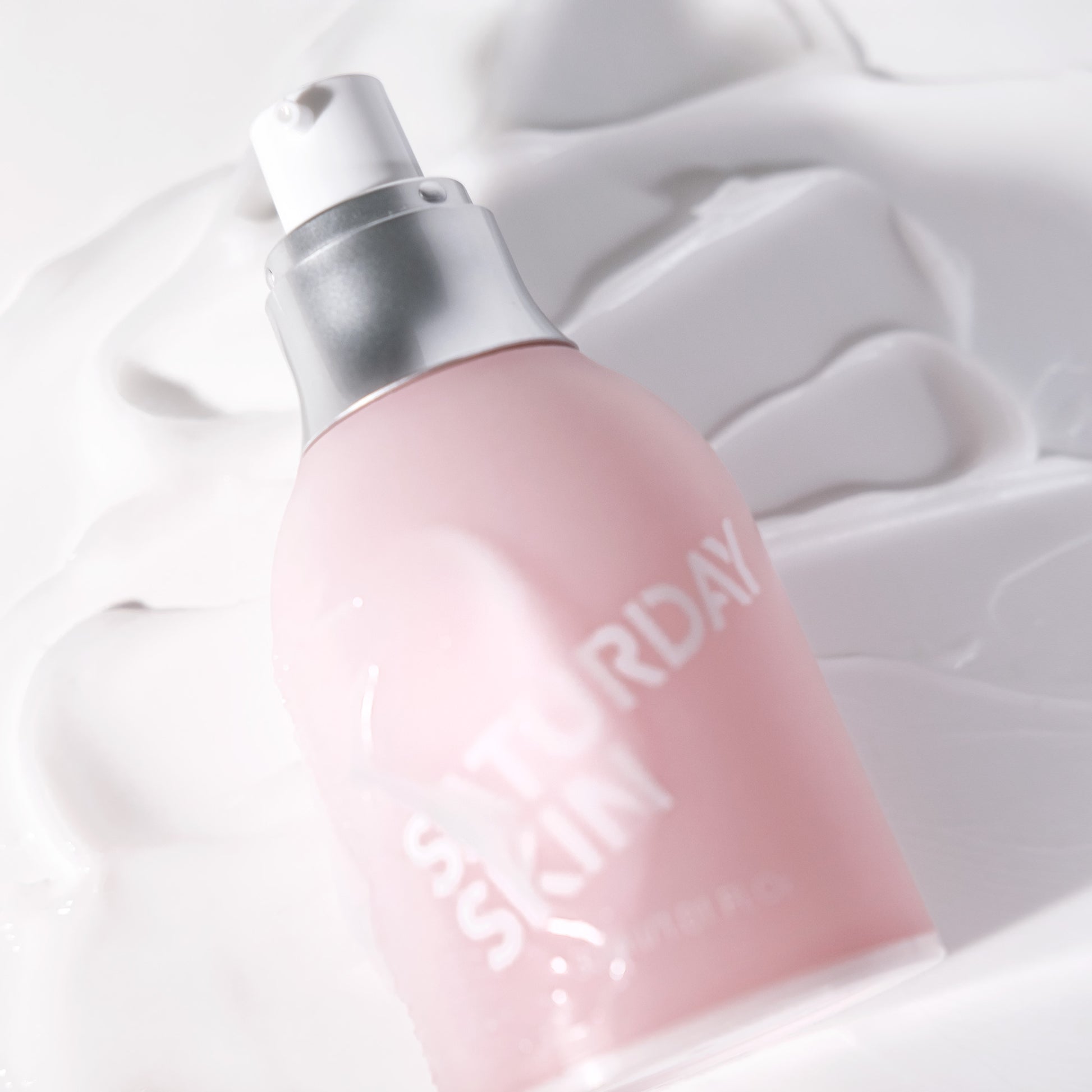 Pink and silver device with 'Suday' branding on a white background